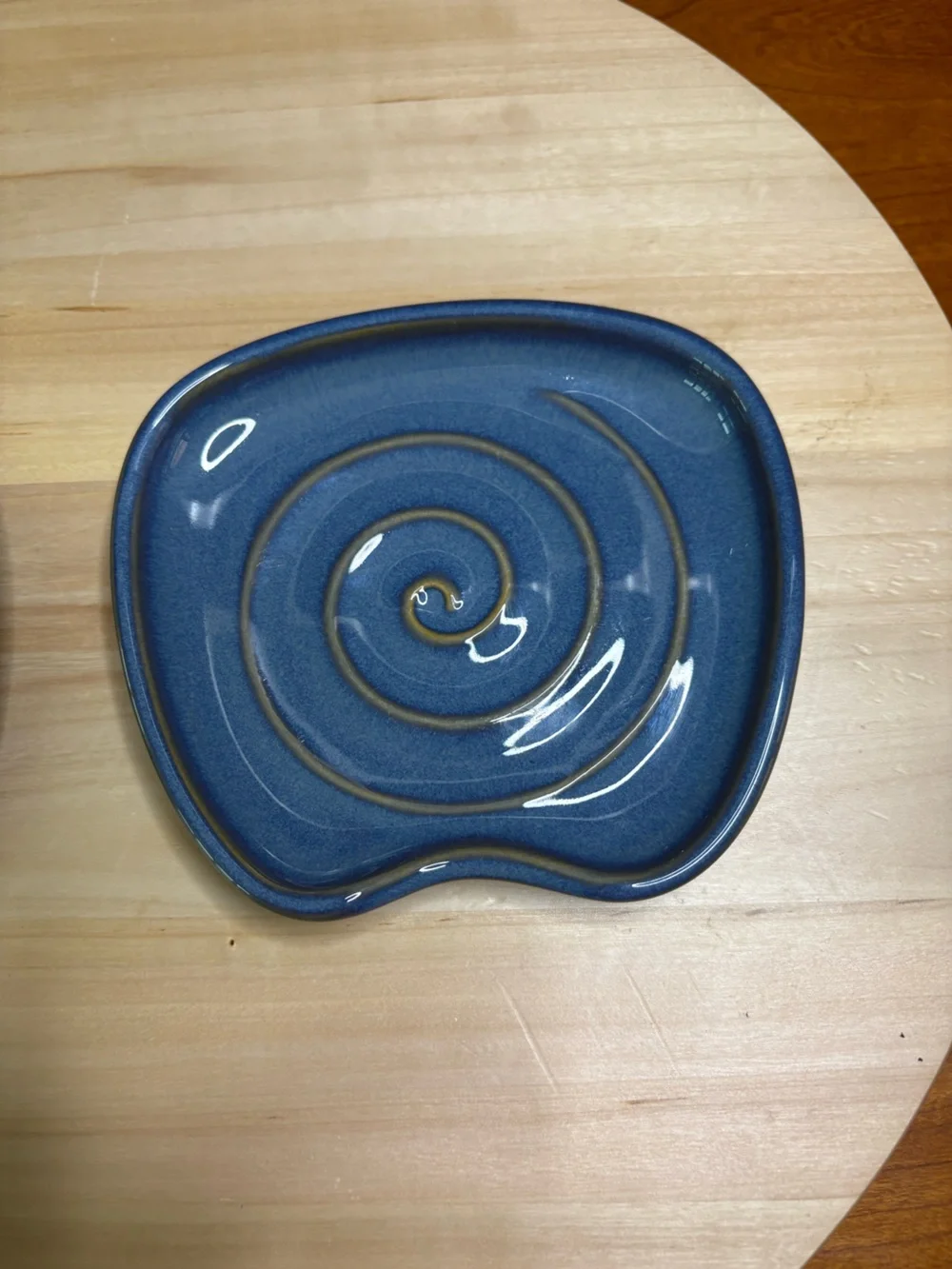 Pampered Chef Nesting Spoon Rest Set featuring a blue glaze with a swirl design.